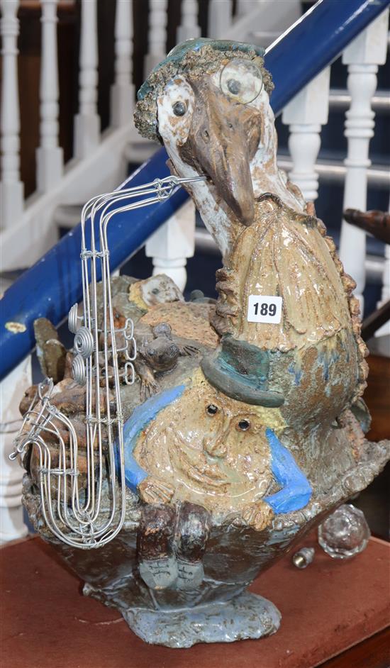 A Studio pottery model of a saxophone-playing pelican